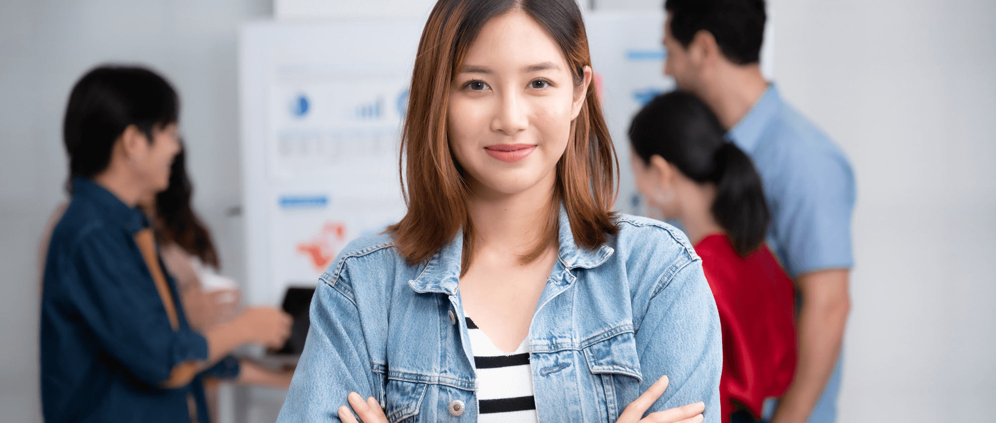 asian woman smiling with crossed arms