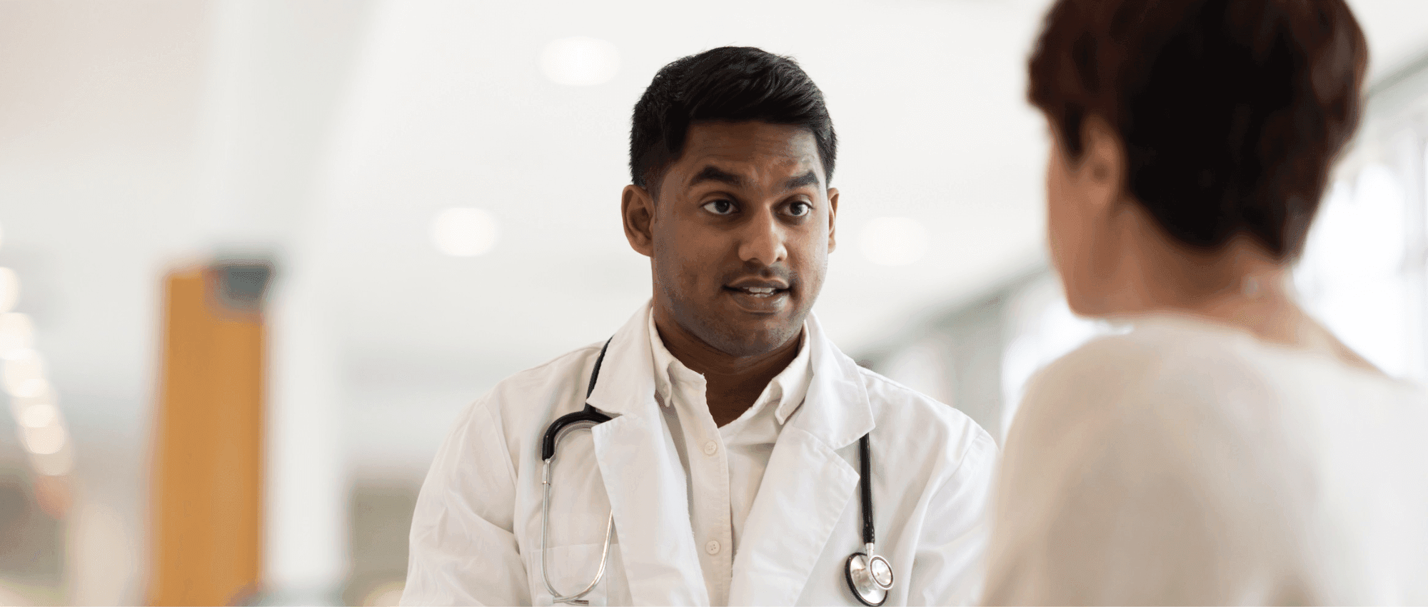 doctor speaking with patient