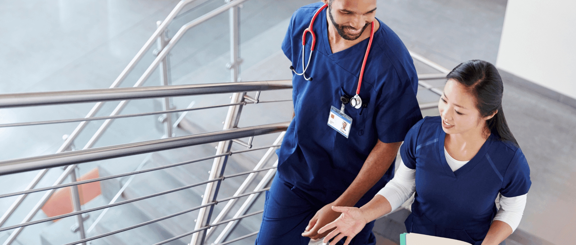 Two doctors climbing the stairs