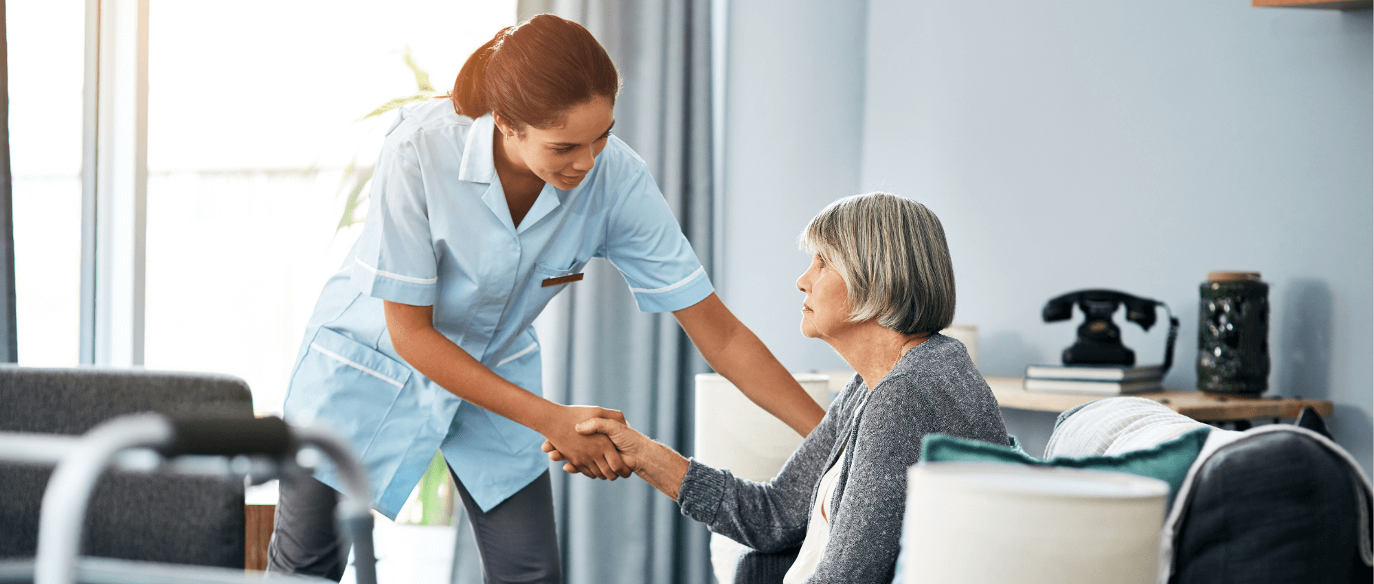A nurse trying to help a senior